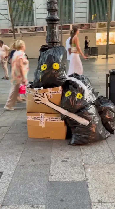 Figures made of rubbish bags and cardboard on a street, Barcelona, Art Is Trash