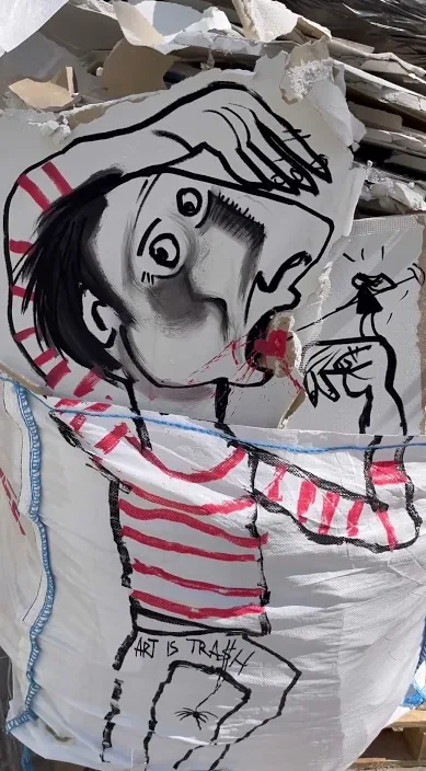 Large drawing of a figure in a striped shirt on the street, Barcelona, Art Is Trash