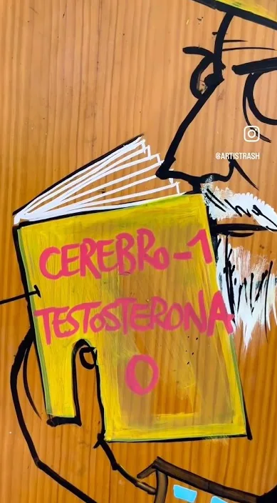 Satirical painting on wood of a figure reading a book, Barcelona, Art Is Trash