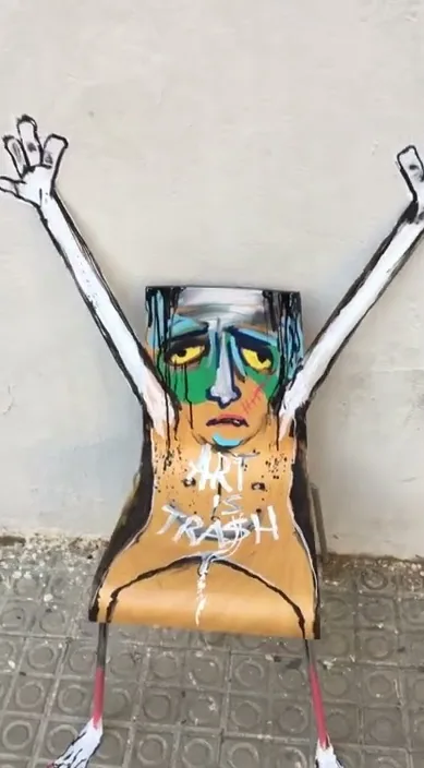 Silla indignada – street art in Barcelona: scene from the Art Is Trash video by Francisco de Pájaro