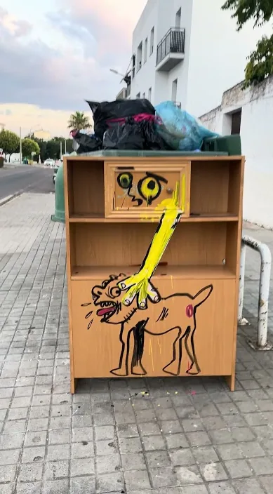 Old cabinet painted with a dog, left on a street in Zafra, Art Is Trash